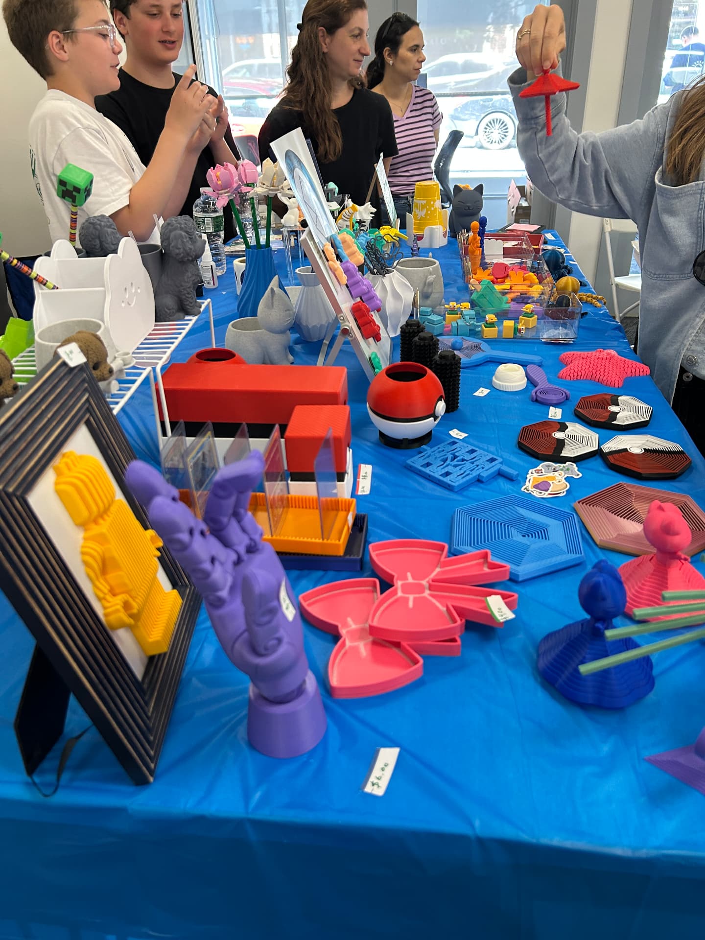 3D Bros booth filled with colorful 3D-printed creations