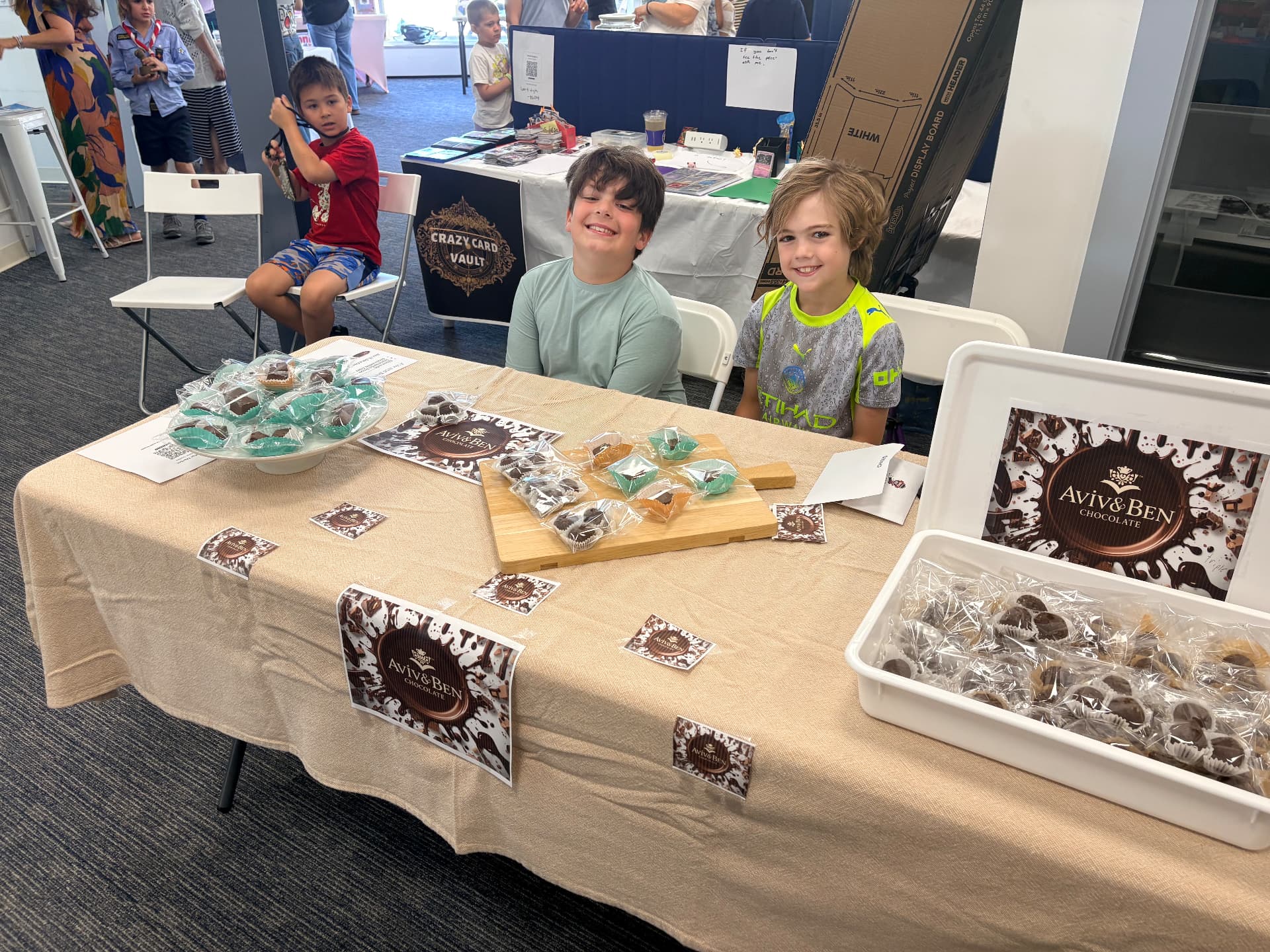 Families visiting the Aviv and Ben Chocolate booth